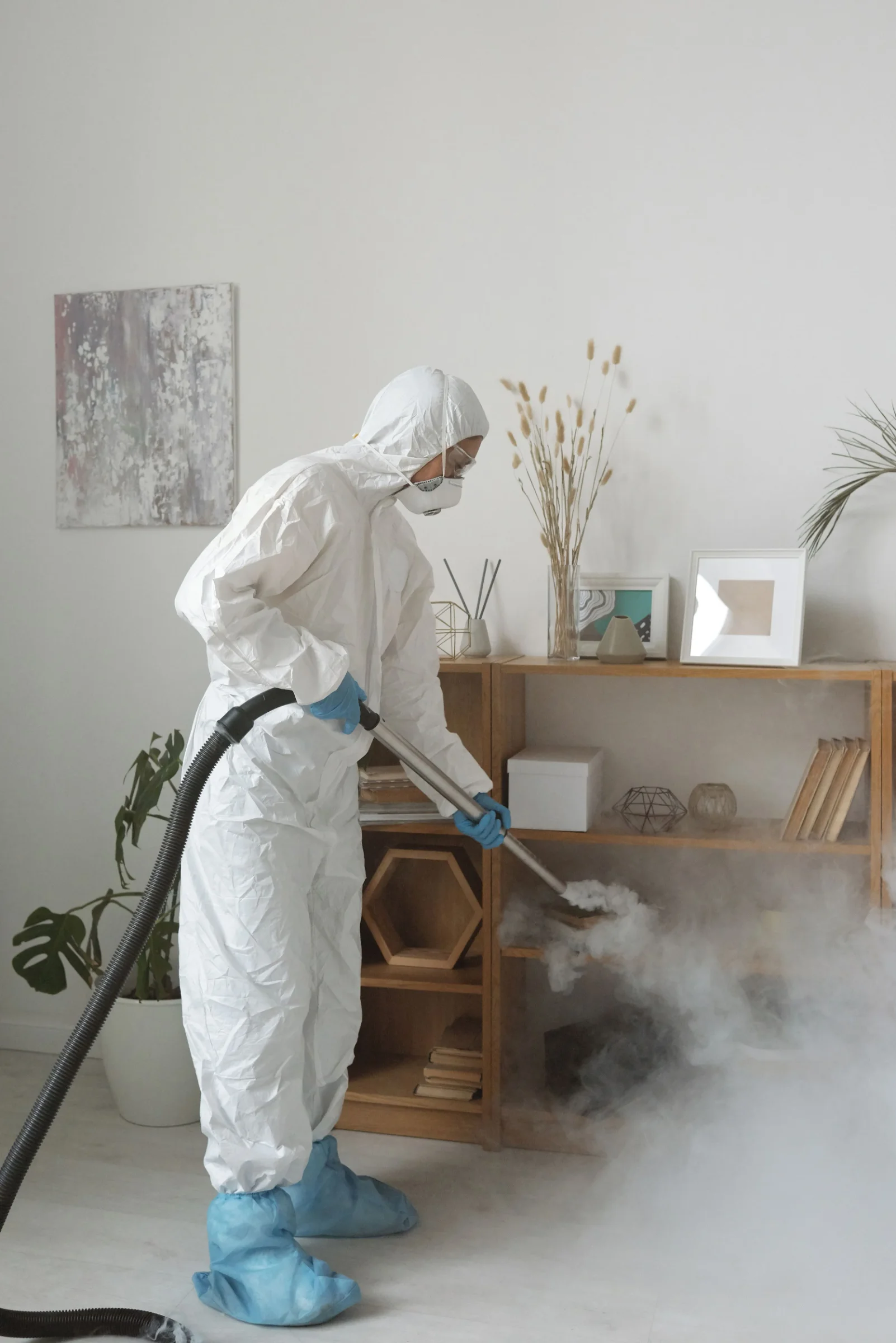 Cleaner sanitising a short-let property between guest stays